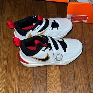 Nike Kids White and Gold Athletic Shoes